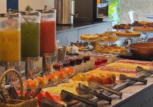 a buffet filled with different types of fruits and vegetables at Nord One in João Pessoa