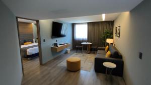 Una cama o camas en una habitación de Alia Inn Boutique WTC