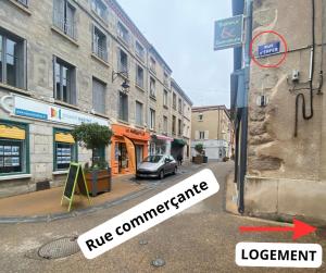 a car parked on the side of a city street at Relax & Cosy Saint Just Saint Rambert in Saint-Rambert-sur-Loire