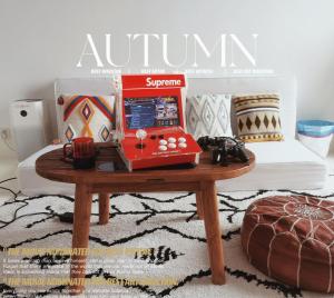 a table with a red appliance on top of a bed at CHENGDU Liaofan Design B&B Houwu Temple Jinli Twin Suite Ximenqiao Street Morogo White Castle HD Projection LOFT Double Floor Bnb High-Quality Housing in Chengdu