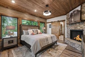 a bedroom with a bed and a fireplace at Teresa's River Retreat in Blue Ridge