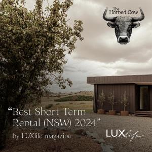 a picture of a cow hanging from a building at The Horned Cow - award winning luxe semi-rural house 10mins from Orange in Lucknow