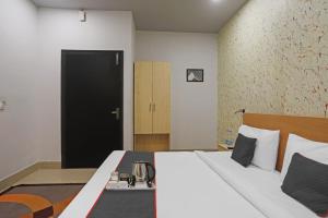 Postel nebo postele na pokoji v ubytování Super Townhouse Grand Pacific Ocean