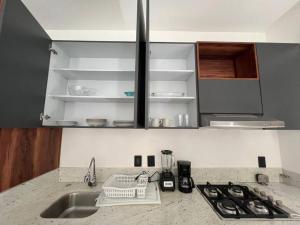 a kitchen with a sink and a counter top at Loft nuevo en Zona Romántica 203 in Puerto Vallarta