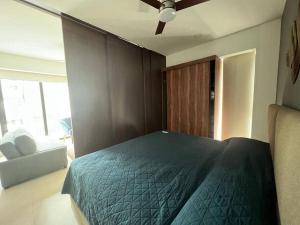 a bedroom with a bed and a ceiling fan at Loft nuevo en Zona Romántica 203 in Puerto Vallarta