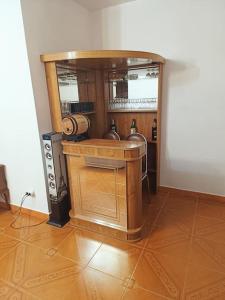 a room with a kitchen with a wooden counter top at Casa do Cruzeiro - Favaios in Favaios