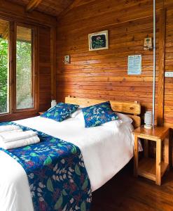 Postel nebo postele na pokoji v ubytování Hotel El Abrazo del Arbol