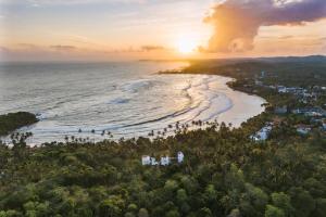 an aerial view of a beach at sunset at Kaas Villas - Entire Two Bedroom Villa With Private Pool & Garden in Dickwella