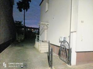 a building with a gate and stairs next to a building at FMI 66 Next to Airport in Mörfelden-Walldorf