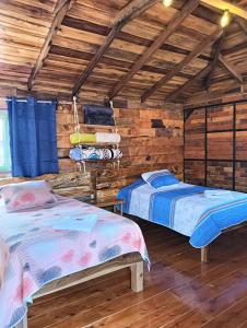 Postel nebo postele na pokoji v ubytování Hotel Areca