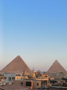 Imagem da galeria de New pyramids way em Cairo