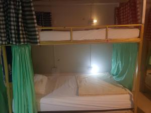 Letto o letti in una camera di Lucky Dorm