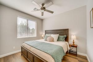 a bedroom with a bed and a ceiling fan at Games and Outdoor Seating Cabin in Scenic Payson! in Payson