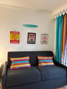 Zona d'estar a Couleur caraïbes-Ti créole appartement pierre et vacances accès plage et piscine