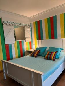 Llit o llits en una habitació de Couleur caraïbes-Ti créole appartement pierre et vacances accès plage et piscine