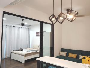 a living room with a mirror and a couch at Almas Suites Poolview Netflix 100mbps BySTAY in Nusajaya +36 photos