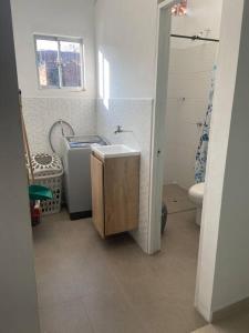 a bathroom with a sink and a toilet and a window at Apartamento en San Rafael in San Rafael