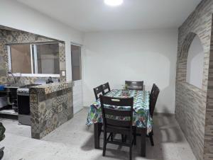 a kitchen and dining room with a table and chairs at Barcena in Durango