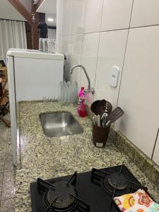 Η κουζίνα ή μικρή κουζίνα στο Loft Dos Anjos +8 φωτογραφίες