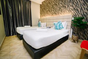 Una cama o camas en una habitación de Kingston Hotel 2 - Setapak 59 fotos más