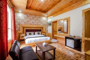 Ένα ή περισσότερα κρεβάτια σε δωμάτιο στο Hotel Cherry Manali