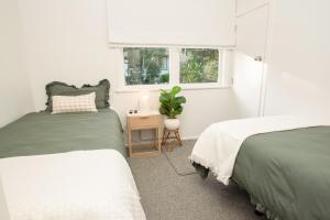 Voodi või voodid majutusasutuse Restful Retreat toas