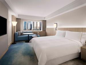 Postel nebo postele na pokoji v ubytování The Westin Josun Busan