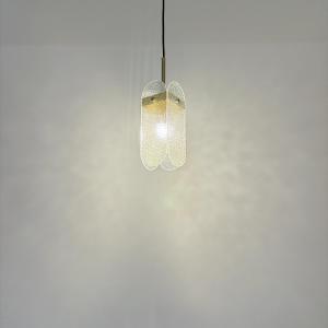 a glass light hanging from a white wall at 過家家民宿GoHouse花蓮市包棟寵物友善 in Hualien City