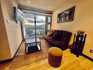 a living room with a couch and a table at Luxury Apt Near Airport in Guatemala