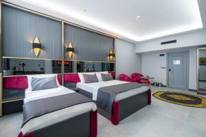 Postel nebo postele na pokoji v ubytování 216 Prestige Hotel + 12 fotografií
