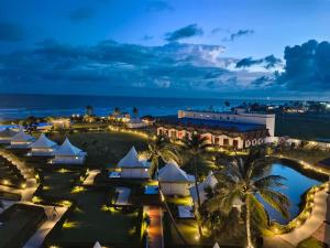 an aerial view of a resort at night at Luxury Amar Tree Resort in Mandarmoni