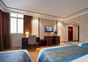 TV a/nebo společenská místnost v ubytování 东玉楼大酒店Zhangjiajie Dong Yu Lou Hotel