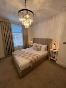Ένα ή περισσότερα κρεβάτια σε δωμάτιο στο Coastal Apartments No 2