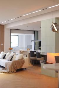 a living room with a bed and a dining room at XinTianDi 3 Bedrooms Newly Luxury Designer Decoration Intelligent Control System in Shanghai