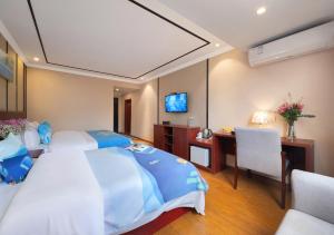 Fotografija u galeriji objekta 东玉楼大酒店Zhangjiajie Dong Yu Lou Hotel u gradu Džangđađe