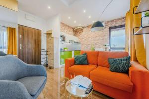 Ruang duduk di Cozy apartment with gym in the City Center
