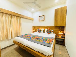 Postel nebo postele na pokoji v ubytování Hotel Regency
