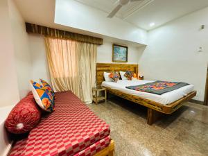 Postel nebo postele na pokoji v ubytování Hotel Regency