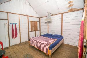 a bedroom with a bed in a room at Pak Mus Guest House Ketambe - 0813-7072-1793 in Kutacane +40 photos
