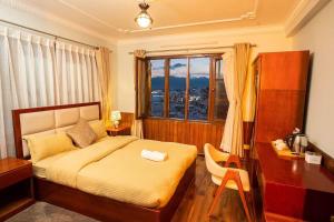 Voodi või voodid majutusasutuse Norbu Hotel toas