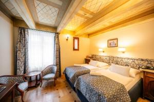 Posteľ alebo postele v izbe v ubytovaní Hotel Elite Prague