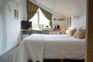 Postel nebo postele na pokoji v ubytování B&B De Dream