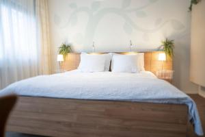 Postel nebo postele na pokoji v ubytování B&B De Dream