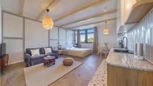 a living room with a couch and a table at Bursztynowa Rewa, Sun & Snow in Rewa