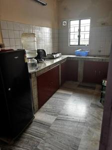 Kuchyň nebo kuchyňský kout v ubytování Sai-Abode Homestay