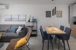 a living room with a table and a couch at Apartment Corsy in Novigrad Istria