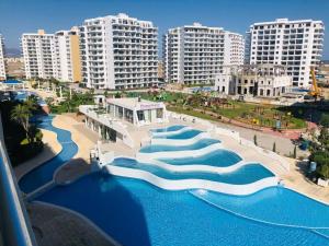 an aerial view of a water park in a city at Caesars Resort - Commodus Studio Flat in Trikomo