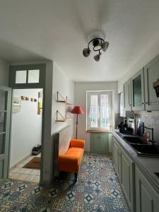 Kuchyň nebo kuchyňský kout v ubytování La Petite Fuxéenne + 10 fotografií