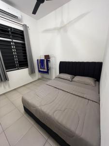 Postel nebo postele na pokoji v ubytování Bayu Laut Homestay (Anjung Gapam)