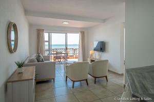 a living room with a view of the ocean at 38 Isikhulu in Umdloti